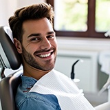 Man sitting in dentist’s chair waiting to see dentist