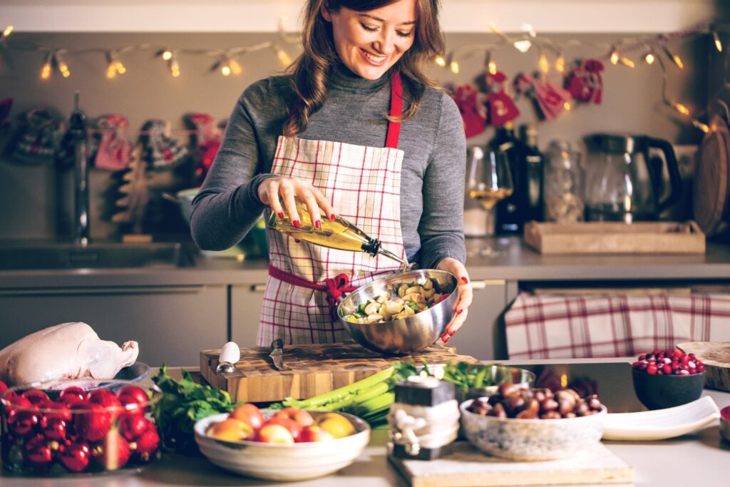 Smiling woman preparing Thanksgiving meal in kitchen